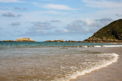 Scenic view of beach against sky