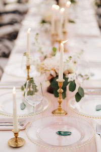 Close-up of illuminated candles on table