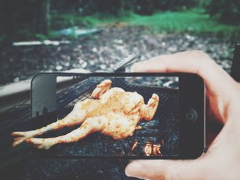 Close-up of meat cooking on barbecue grill