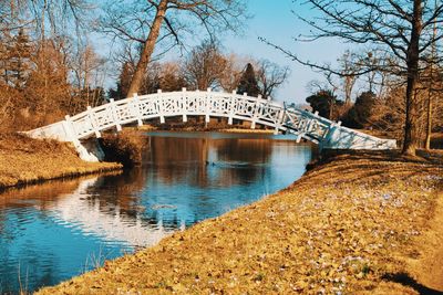 Arch bridge over river against sky