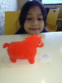 Portrait of a smiling girl in toy at home