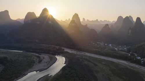 Aerial view of mountains during sunrise