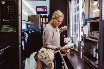 Friends standing at store