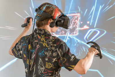 Side view of man using vr glasses 