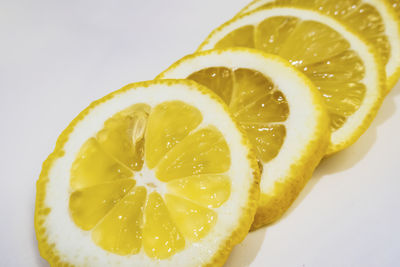 Close-up of lemon slice against white background