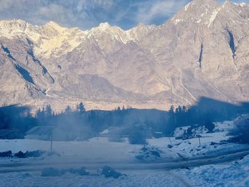 Scenic view of snowcapped mountains against sky