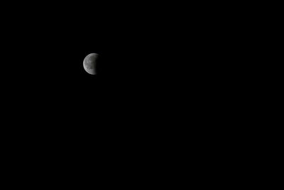 Low angle view of moon against sky at night