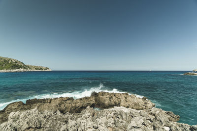 Scenic view of sea against clear sky