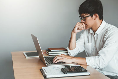 Man using laptop on table