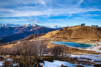 Scenic view of mountains against sky during winter