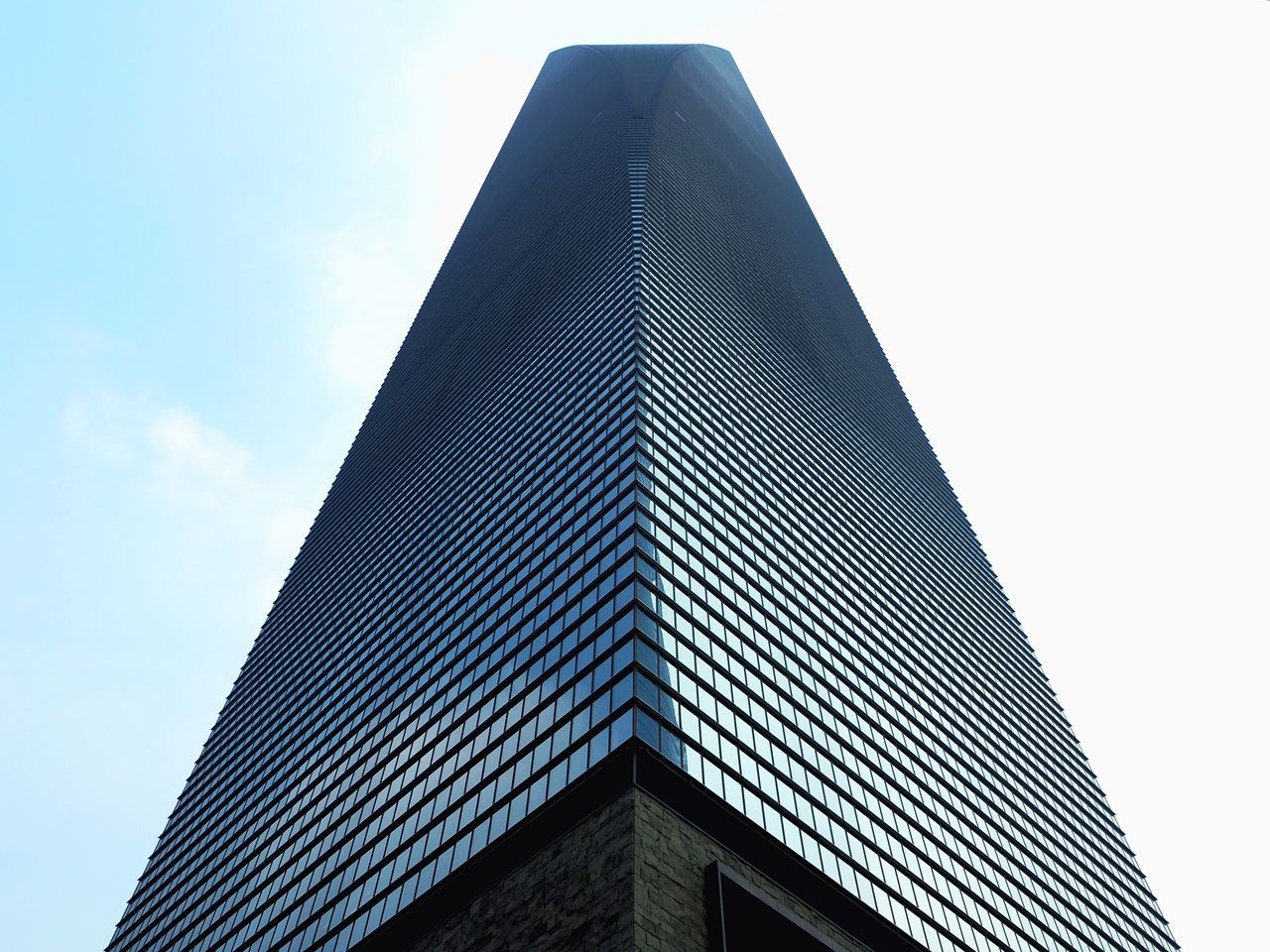 architecture, low angle view, building exterior, built structure, tall - high, tower, clear sky, city, skyscraper, sky, modern, office building, building, tall, day, high section, outdoors, no people, architectural feature, copy space