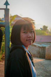 Portrait of woman standing outdoors