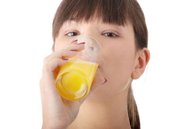 Close-up portrait of a man drinking glass