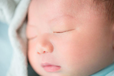 Close-up portrait of cute baby sleeping