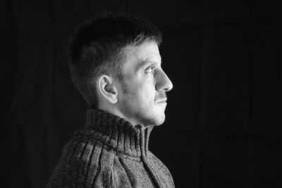 Portrait of young man looking away