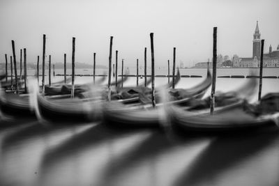 Boats moored in water