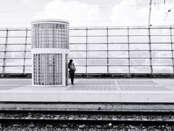 Full length of woman walking on tiled floor