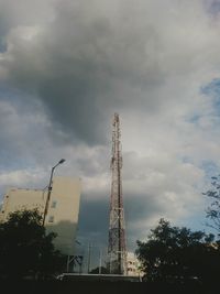 Low angle view of tower against cloudy sky