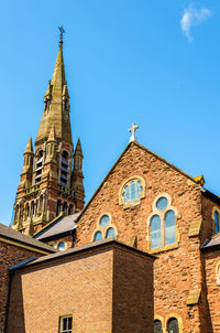 Low angle view of historic building against clear blue sky