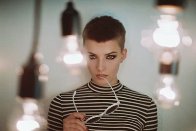 Woman standing in illuminated room