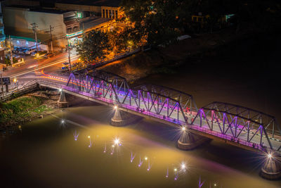 High angle view of illuminated bridge over canal at night