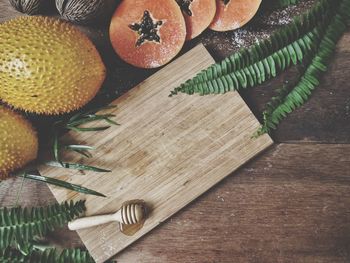 High angle view of fruits on cutting board on table