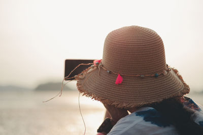 Rear view of woman wearing hat