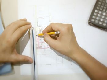 High angle view of woman working on table