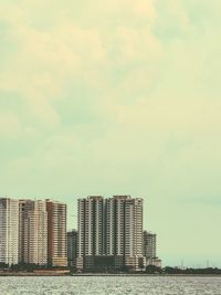 Buildings in city against sky