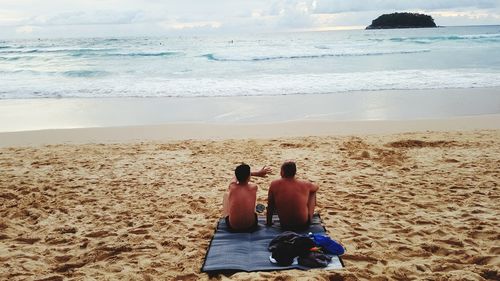 Father and son on beach