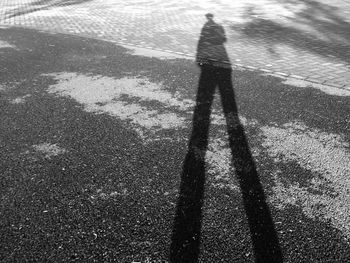 Shadow of people on road