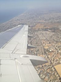 Aerial view of sea seen through airplane window