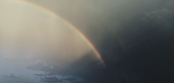 Low angle view of rainbow in sky