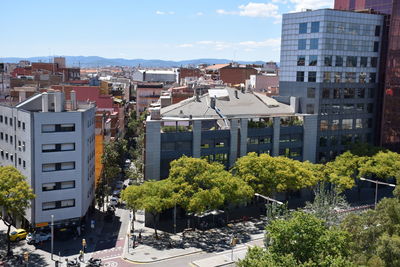 High angle view of trees and buildings against sky