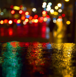 Defocused image of illuminated city at night