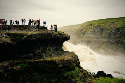 Tourists on cliff