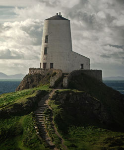 View of lighthouse against cloudy sky