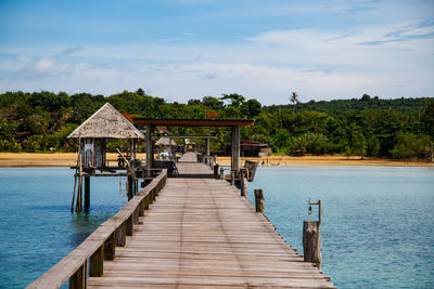 Pier over lake against sky