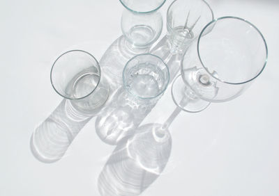Close-up of wineglass on white background