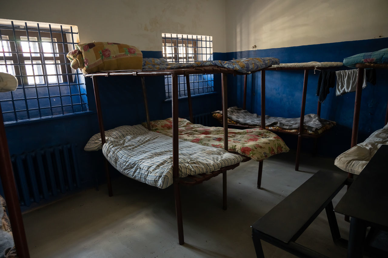 EMPTY CHAIRS AND TABLE IN BED