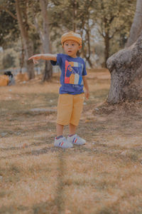 Full length of boy running on field