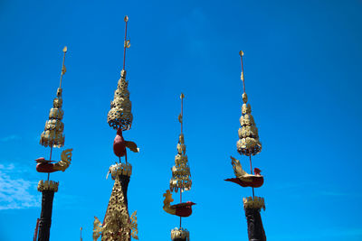 Low angle view of lanterns hanging against sky