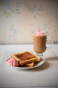 Close-up of breakfast served on table. toast and coffee.