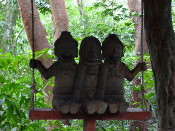 Low angle view of statue against trees