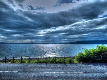 Scenic view of sea against cloudy sky