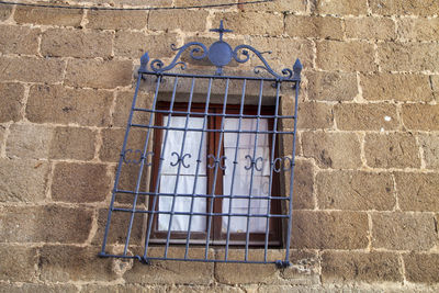 Low angle view of window on wall