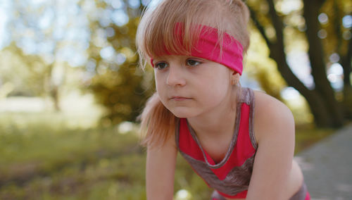 Portrait of young woman standing outdoors