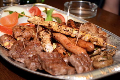 Close-up of meat in plate on table, barbecue