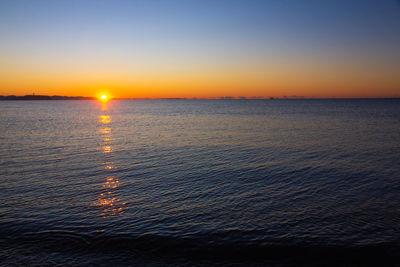 Scenic view of sea against sky during sunset