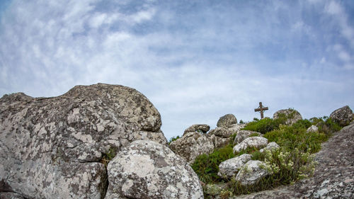 Low angle view of rock formations against sky